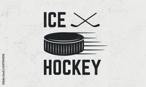 Ice Hockey vintage emblem, badge, poster. Trendy vintage poster with crosse ice hockey cues and puck. Grunge texture. Vector illustration