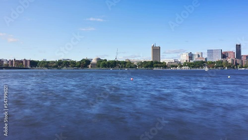 Looking across the Charles River at MIT's Maclaurin Building and Cambridge, Massachusetts - time lapse  photo