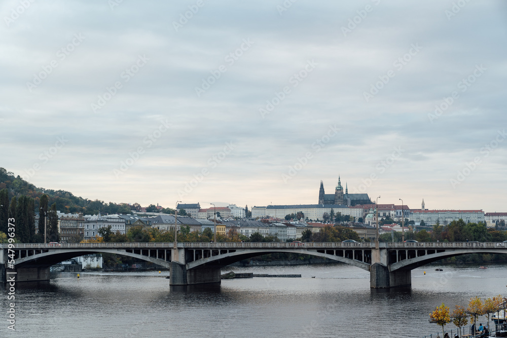 Riverside scenery in Prague, Czech Republic with Prague Castle, bridges and buildings