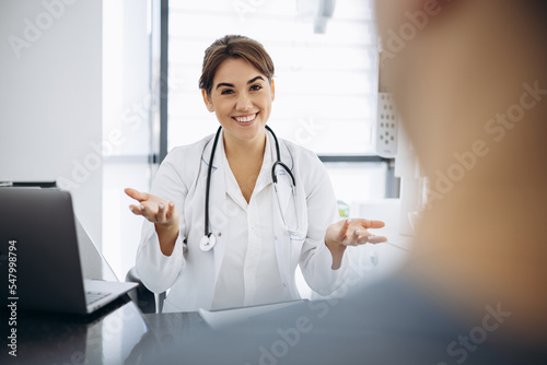 Woman doctor with patient at clinics