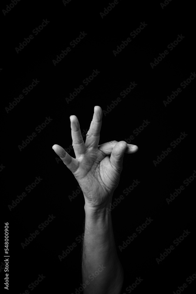 Hand demonstrating the French sign language letter 'T' with copy space Hand demonstrating the French sign language letter 'T' with copy space