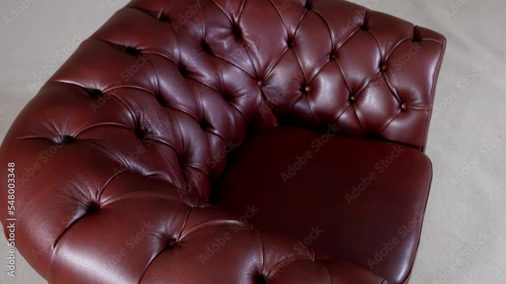 Modern stylization of the classic leather red armchair. Textile upholstery modern apartment is a beautiful model for a luxurious interior. Modern stylization of the classic leather red armchair. Textile upholstery modern apartment is a beautiful model for a luxurious interior.