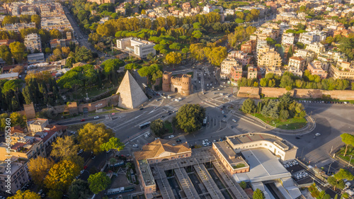 Aerial view of Ostiense square and Pyramid of Cestius, a Roman Era pyramid located in Rome, Italy. photo
