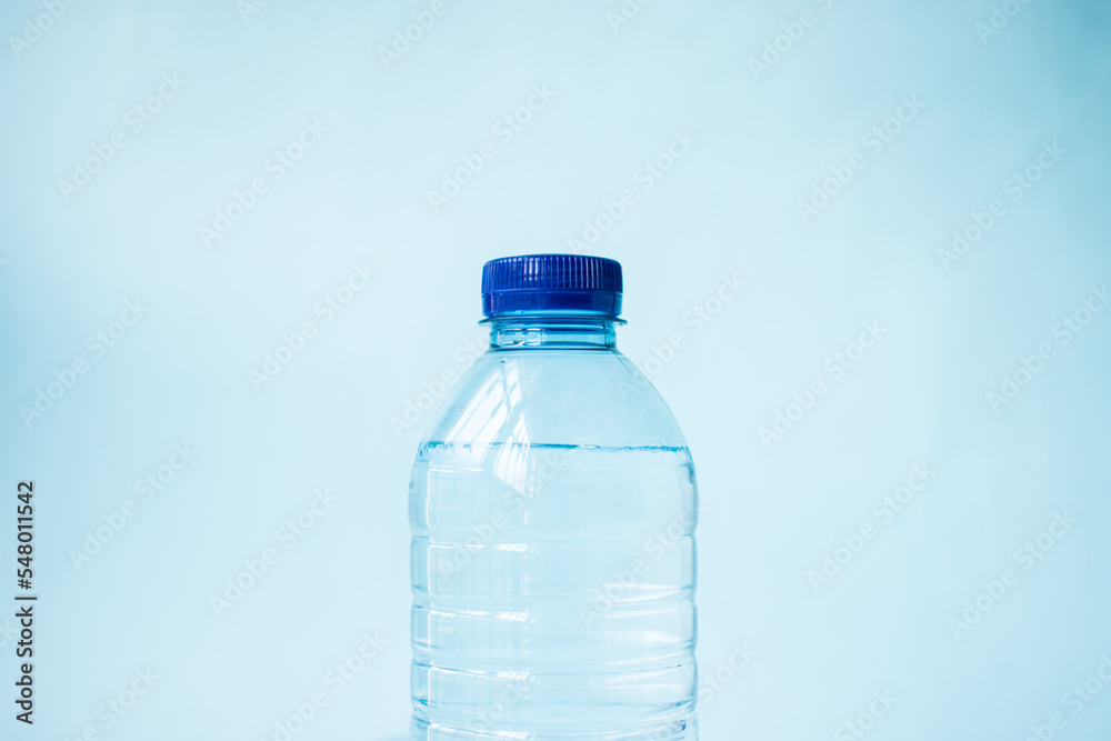 Plastic water bottle on blue background