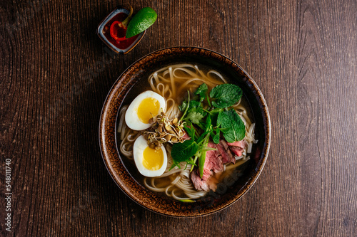 vietnamese national pho soup on a wooden table