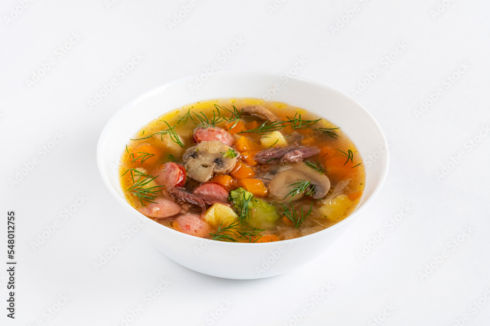 vegetable soup with sausages on white background vegetable soup with sausages on white background
