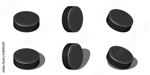 Hockey puck set isolated on white with shadow. Lying and rolling version of puck, cartoon style. Vector element for sport design, professional ice hockey event banner or winter outdoor illustration.