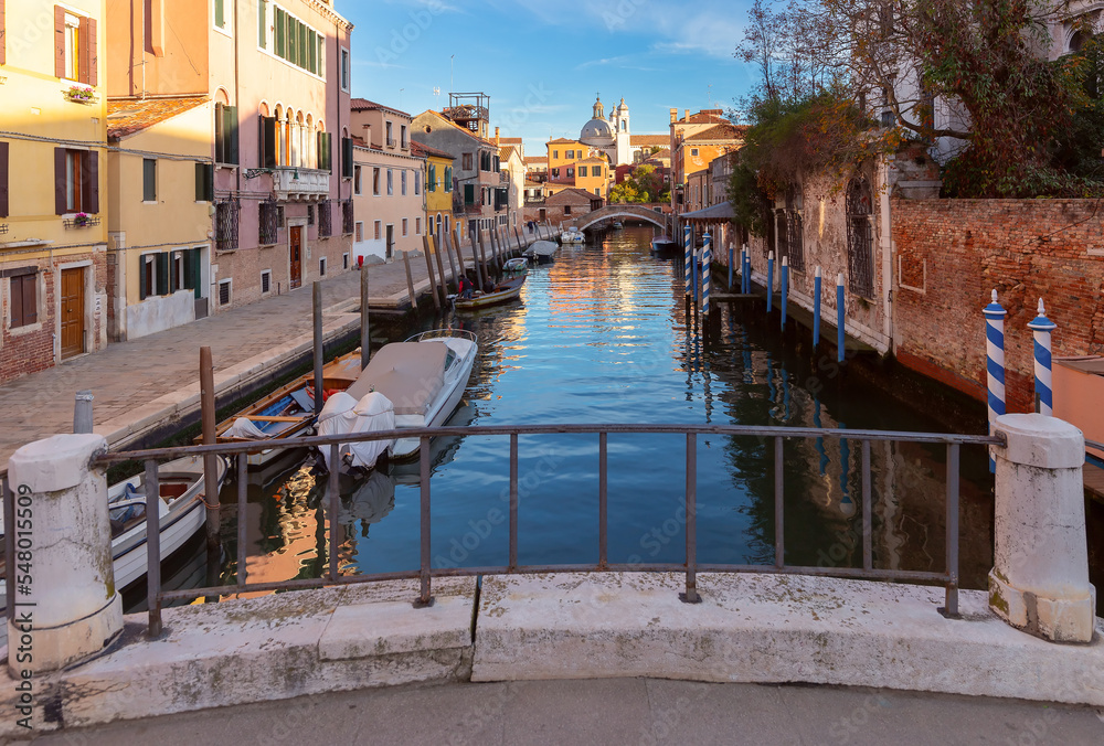 Traditional Venetian houses along the canal at sunset.