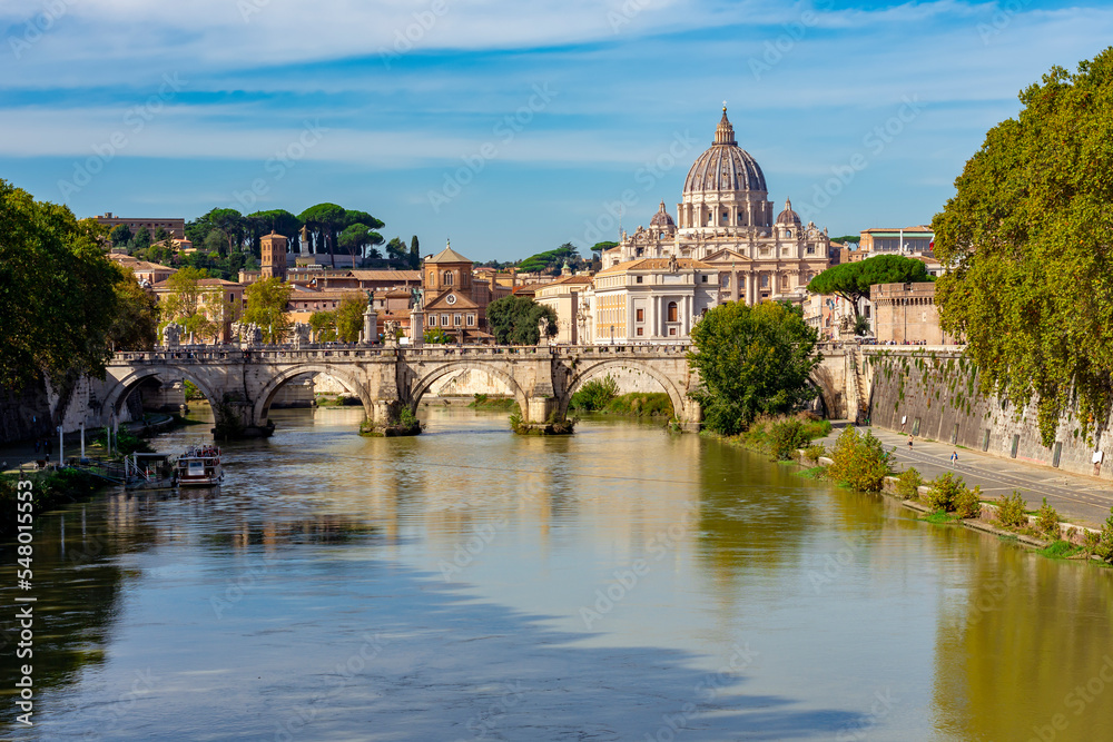 St Peter's basilica in Vatican and St. Angel bridge over Tiber river in Rome, Italy