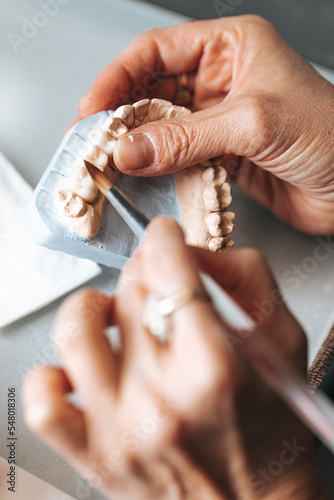 Dental Technician Making Ceramic Crowns photo