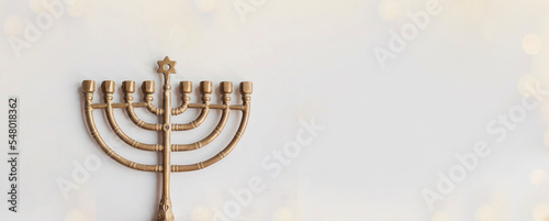 Hanukkah card design with golden symbols on white background for Jewish holiday Hanukkah. Banner.  Cope space
