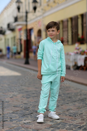 child walking on the street © екатерина Цыганок