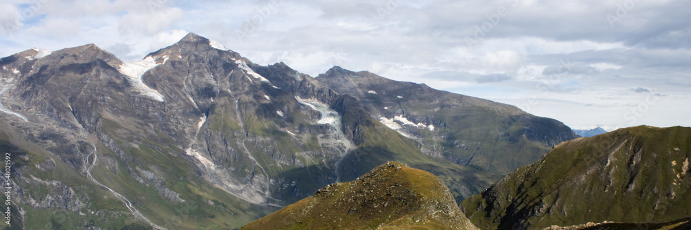 View of the Austrian Alps on the Grossglockner. Sunny day in the mountains. Panorama photo.