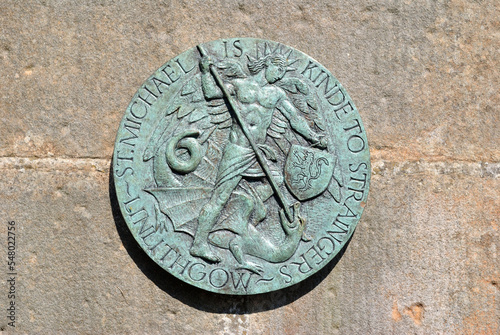 Round Decorative Metal Plaque with Sculpted Figure and Text  