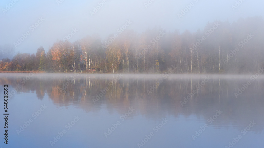 Fog on shores of Finnish Tuusula lake: morning, autumn, calm.