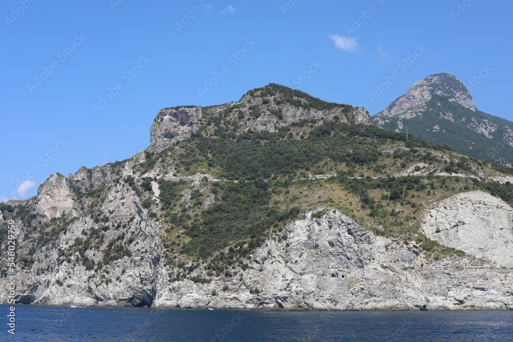 view of the sea and mountains. view of the coast of island. coast of the region. landscape with mountains and sea. landscape with blue sky and clouds. sea and rocks