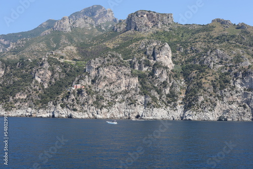 Fototapeta Naklejka Na Ścianę i Meble -  view of the sea and mountains. view of the coast of island. coast of the region. landscape with mountains and sea. landscape with blue sky and clouds. sea and rocks