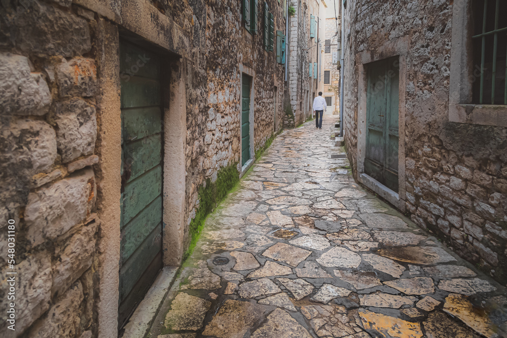 An old cobbelstone lane in the historic Sibenik Old Town, Croatia. An old cobbelstone lane in the historic Sibenik Old Town, Croatia.