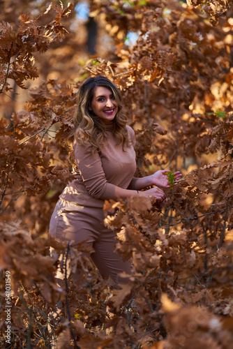 Size plus woman in a forest in the autumn