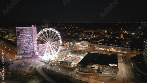 Aerial footage of a Ferris wheel in Zandvoort, the Netherlands at night