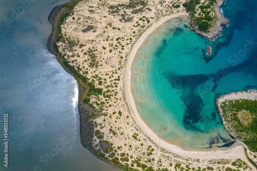 Aerial drone photo of the iconic  semicircular sandy beach of Voidokoilia in Messinia, Gialova, Peloponnese, Greece photo