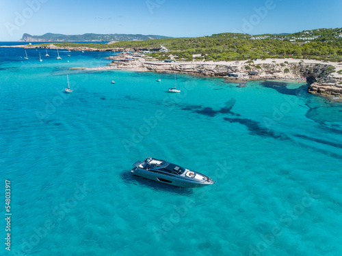 Luxury Motor Boat Anchored in Shallow Turquoise Waters © Stock87