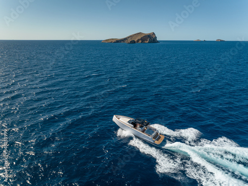 Motor Boat Tender Speeding Through the Ocean in the Summer