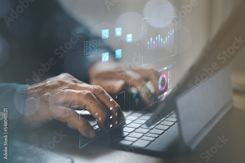 Analyst working with Business Analytics and Data Management System on computer, make a report with KPI and metrics connected to database. Corporate strategy for finance, operations, sales, marketing.