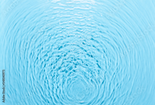 Background with water  waves on the water in the pool during the day  cosmetic moisturizer emulsion
