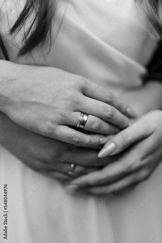 the bride and groom tenderly hold hands between them love and relationships the bride and groom tenderly hold hands between them love and relationships
