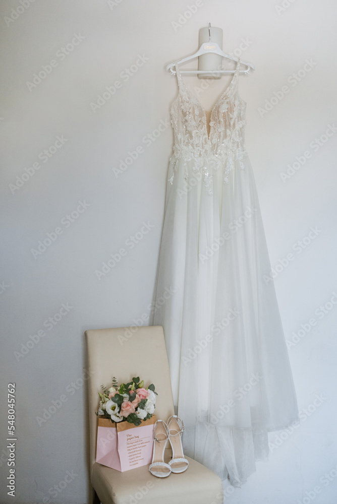 dress up the bride in a wedding dress with corset and lacing