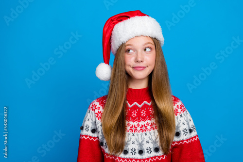 Photo of positive cheerful good mood girl with straight hairstyle dressed red pullover look empty space isolated on blue color background