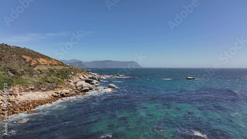 Aerial view of the sea and green-covered rocky cliffs near the Cape of Good Hope in South Africa
