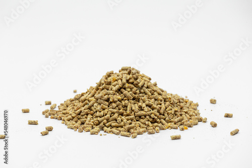 Fraction of feed additives for animals on a white background in the form of a pyramid