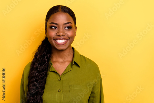 Portrait of attractive cheerful wavy-haired girl executive manager thinking copy space isolated over bright yellow color background
