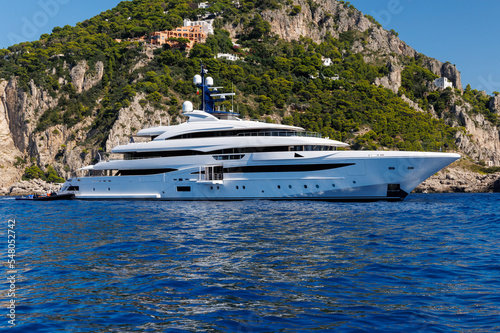 yacht in the sea off Faraglioni rocks at Capri Italy © MEANDERING TRAIL