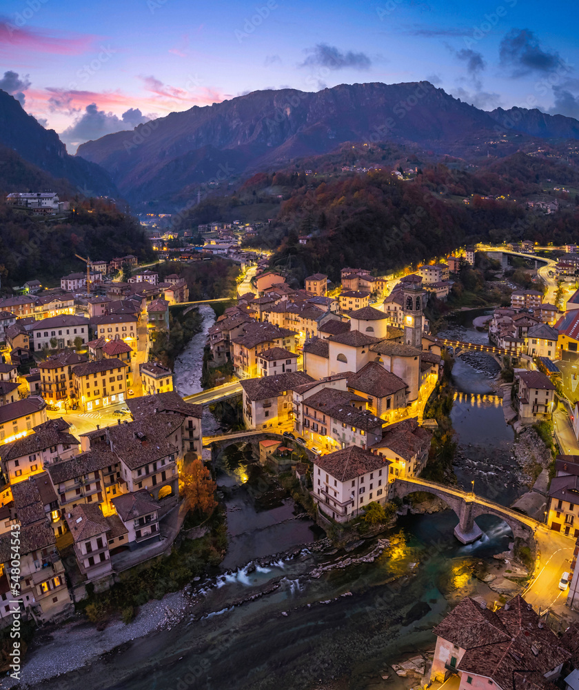 Beautiful aerial night cityscape of little town in Bergamo at blue hour, San Giovanni Bianco, Bergamo, Val Brembana, Lombardy, Italy