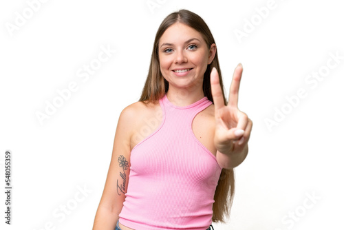 Young beautiful blonde woman over isolated background smiling and showing victory sign