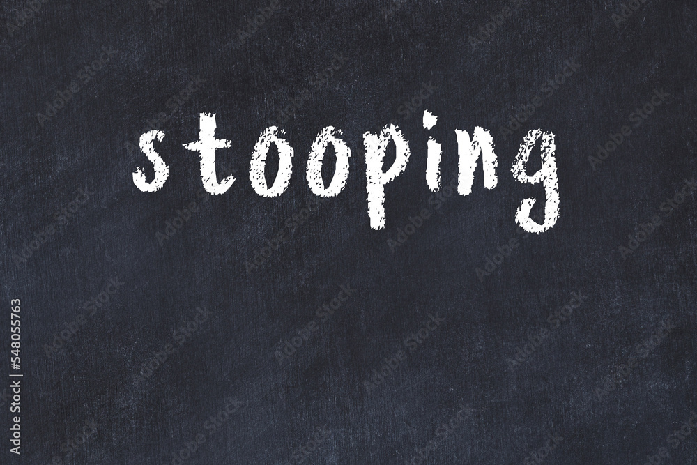 Fotografie Black chalkboard with inscription stooping on in