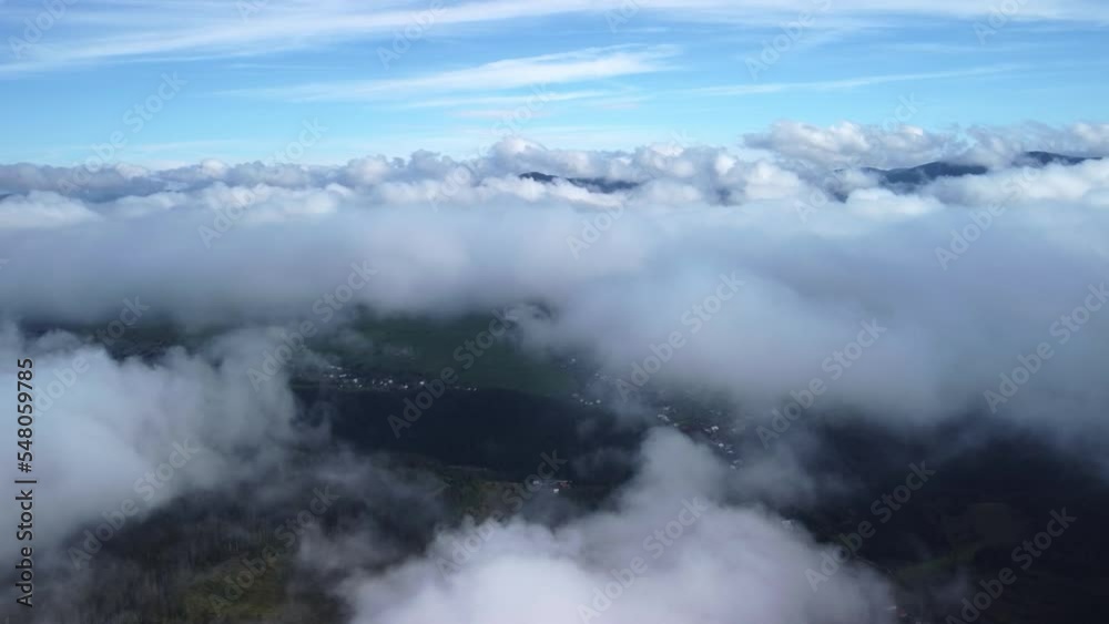 Flying over rural green landscape with misty clouds, Flying over rural green landscape with misty clouds,