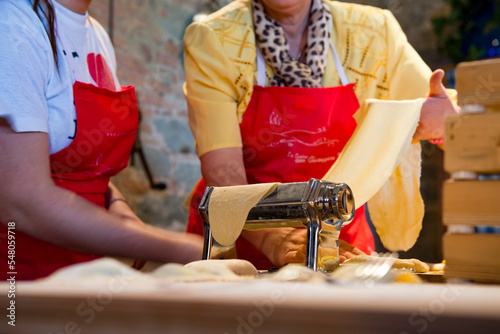 Making pasta in the kitchen in Tuscany, Italy.