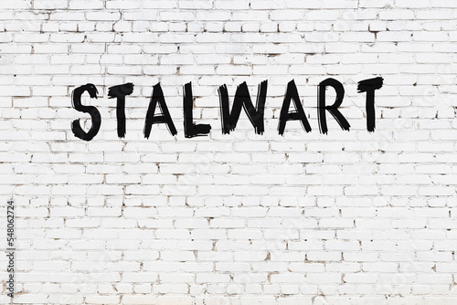 Inscription stalwart painted on white brick wall