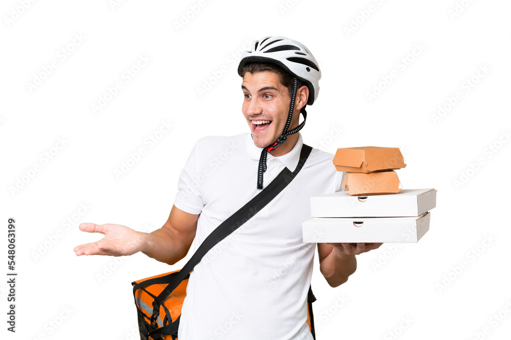 Young caucasian man with thermal backpack over isolated background with surprise expression while looking side Young caucasian man with thermal backpack over isolated background with surprise expression while looking side