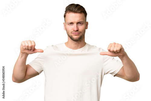 Young blonde caucasian man over isolated background proud and self-satisfied