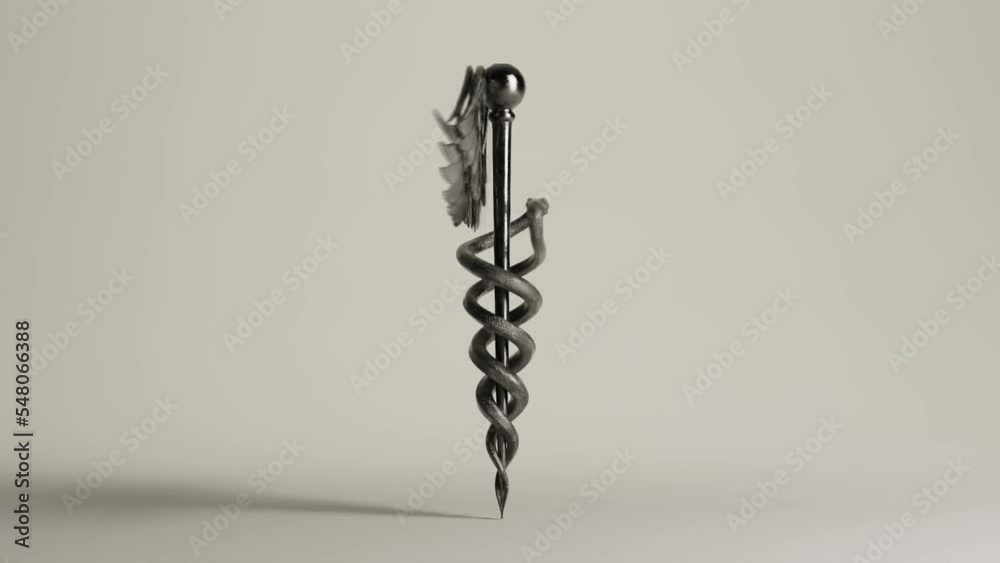 A silver caduceus symbol with wings and snakes rotating seamlessly on an isolated studio background 