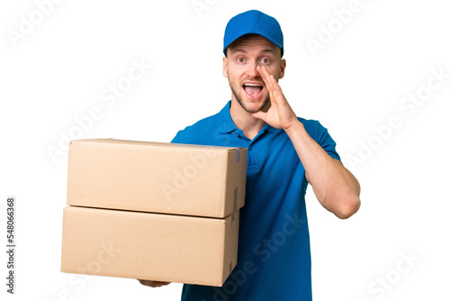 Delivery caucasian man over isolated background shouting with mouth wide open