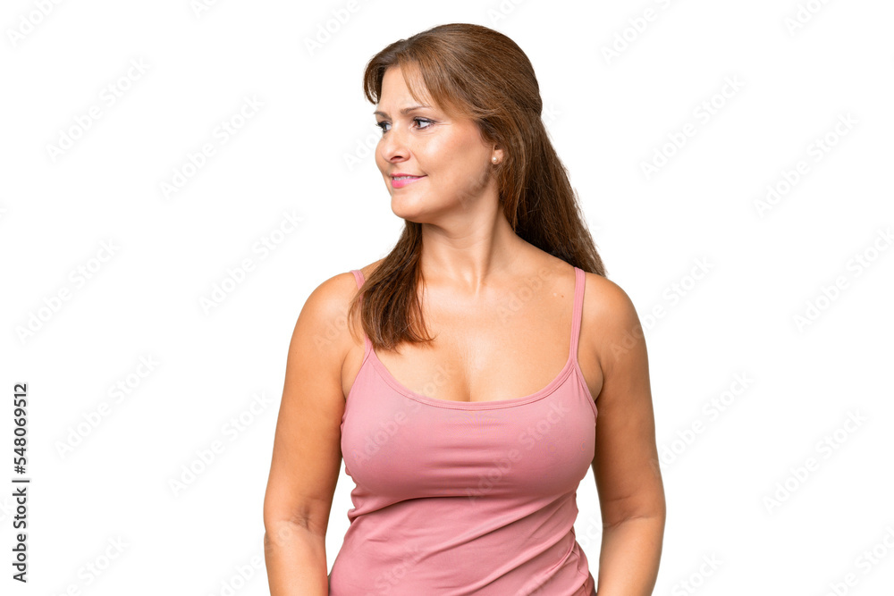 Middle-aged caucasian woman over isolated background looking side Middle-aged caucasian woman over isolated background looking side