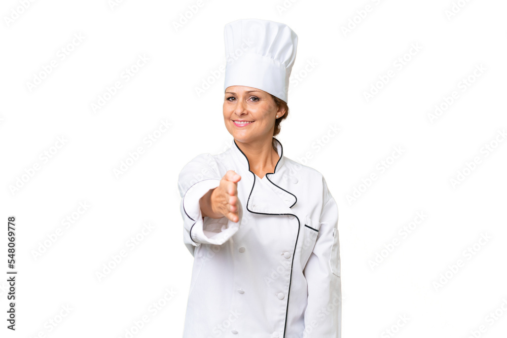 Middle-aged chef woman over isolated background shaking hands for closing a good deal Middle-aged chef woman over isolated background shaking hands for closing a good deal