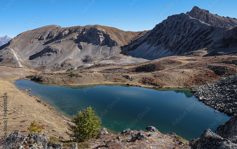 View of Lac de l'Oule mountain lake (2,425 m), beneath Col de l'Oule (2,546 m), located near Col de Granon (2,413) in rhe Hautes-Alpes department, Briancon, France