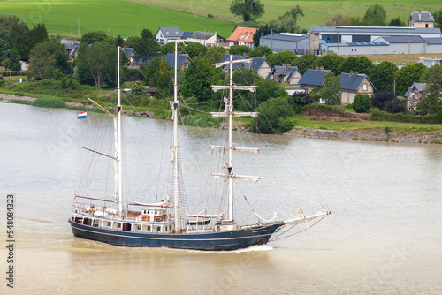 TANCARVILLE, NORMANDY, FRANCE: arrival of the 2019 Armada tall ships, Thalassa sailing in the Seine River photo